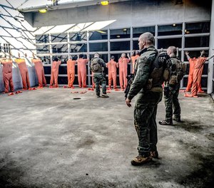 A promotional photo for Corrections Special Applications Unit.