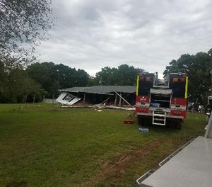 While firefighters battled a house fire, an explosion occurred, injuring six firefighters.