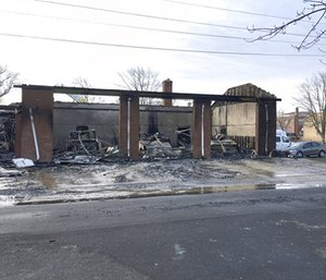 Authorities say a fast-moving fire gutted an ambulance squad's building in New Jersey, destroying five ambulances and causing at least $2 million in damage overall.