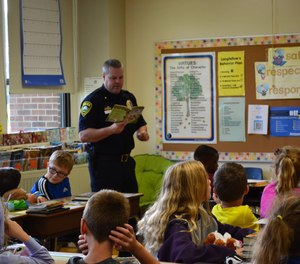 Rochester Police Chief Franklin reads to elementary school students in Rochester Public Schools.