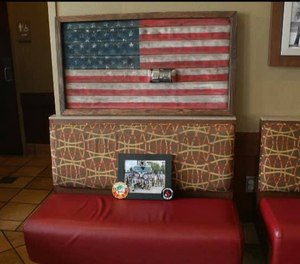 Panama City Beach firefighter Daryl Paul takes discarded fire hoses, paints them into American flags and sells them. (Photo/Panama City Beach Fire Rescue)
