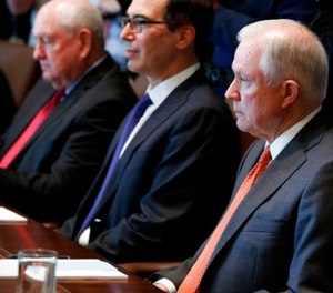Attorney General Jeff Sessions listens as President Donald Trump speaks during a cabinet meeting in the Cabinet Room of the White House, Monday, July 31, 2017, in Washington. (AP Photo/Evan Vucci)