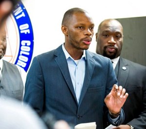 In this June 5, 2017, file photo, Arizona state Democratic Rep. Reginald Bolding Jr., left, calls on Gov. Doug Ducey to remove six confederate monuments in Arizona during a news conference by the NAACP and Black Lives Matter in Phoenix, Ariz.