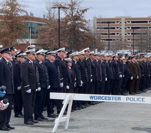 Firefighters, police officers and paramedics from across Massachusetts lined up outside Mercadante Funeral Home in Worcester on Sunday afternoon, paying their respects to Menard, who was killed in a four-alarm fire early Wednesday morning.