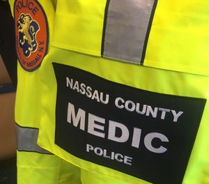 A Nassau County Police paramedic was kicked in the chest and an officer was kicked in the neck during an incident at a Walmart Saturday, officials say.