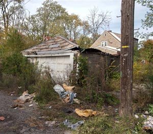 In this Oct. 19, 2014 photo is the back of a house in Gary, Ind., where the body of a woman was found on Sunday. (AP Image)