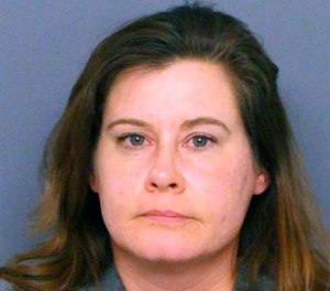 This undated booking photo provided by the Denver police shows Colorado state Rep. Lori Saine.