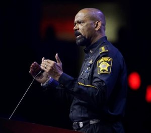 In this May 20, 2016, file photo, Milwaukee County Sheriff David Clarke speaks at the National Rifle Association convention in Louisville, Ky.