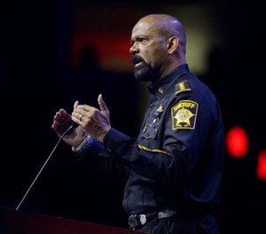 In this May 20, 2016, file photo, Milwaukee County Sheriff David Clarke speaks at the National Rifle Association convention in Louisville, Ky.