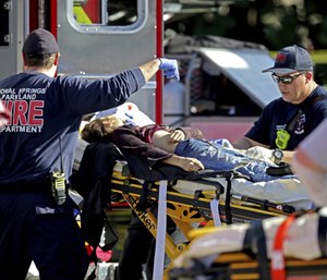 The Coral Springs Fire Department is shown treating a patient after a shooting at Marjory Stoneman Douglas High School.