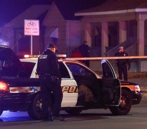 Wichita police investigate a call near the corner of McCormick and Seneca in Wichita, Kan. Thursday night 12/28. A man was fatally shot by a police officer in what is believed to be a