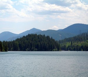 The firefighter was paddle boarding on Cle Elum Lake with a friend on Saturday.