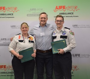 Kevin DeVries (center) met Life EMS providers Christy Carter (left) and Colin Chrenka at an award ceremony on Wednesday. Carter and Chrenka revived DeVries after he went into cardiac arrest last summer.