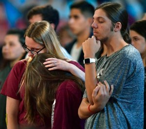 Marjory Stoneman Douglas High School students listen to sheriff Scott Israel speak before a CNN town hall broadcast, Wednesday, Feb. 21, 2018, at the BB&T Center, in Sunrise, Fla. (Michael Laughlin/South Florida Sun-Sentinel via AP)