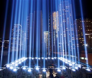 In this Sept. 10, 2013 file photo, the Tribute in Light rises above buildings during a test in New York. While the plaza at the National September 11 Memorial and Museum will be closed to the public, during the September 11 commemoration ceremony and much of the rest of the day, it will be open from 6 p.m. to midnight for those who want to pay respects and view one of the anniversary's most evocative traditions, the twin beams called the Tribute in Light. (AP Photo/Mark Lennihan, File)