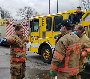 City firefighters in Watertown, N.Y. participate in DECON procedure training. Firefighter Peyton L.S. Morse died during a training exercise earlier this spring.