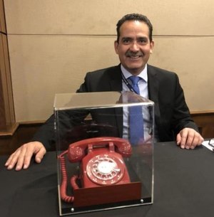 The author was entrusted with the safety and security of the phone used to make the first 911 call in the nation during its trip to Washington this week.