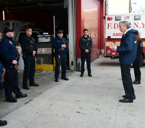 New York City Mayor Bill de Blasio speaks with EMTs and paramedics at FDNY EMS Station 50 in Queens on Thursday, April 2. De Blasio said in a radio interview Friday that the COVID-19 pandemic is