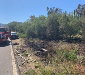 A man suffered an apparent heart attack while running to get help for a brush fire on the side of a California highway.