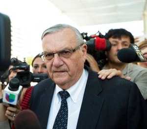 In this July 6, 2017, file photo, former Sheriff Joe Arpaio leaves the federal courthouse in Phoenix, Ariz.