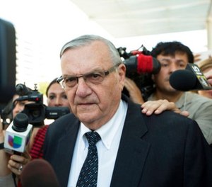 In this July 6, 2017, file photo, former Sheriff Joe Arpaio leaves the federal courthouse in Phoenix, Ariz.