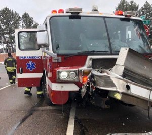 Four Colorado firefighters were injured when their fire apparatus collided with another vehicle.