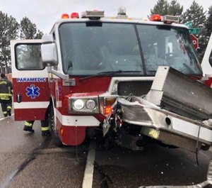 Four Colorado firefighters were injured when their fire apparatus collided with another vehicle.