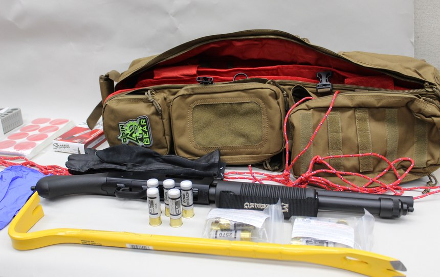 The bag also contains tactical gloves, a pry bar, a breaching shotgun and breaching rounds.