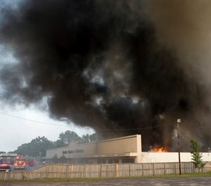 Smoke pours out of the Sofa Super Store furniture warehouse in Charleston, S.C. on Monday, June 18, 2007.