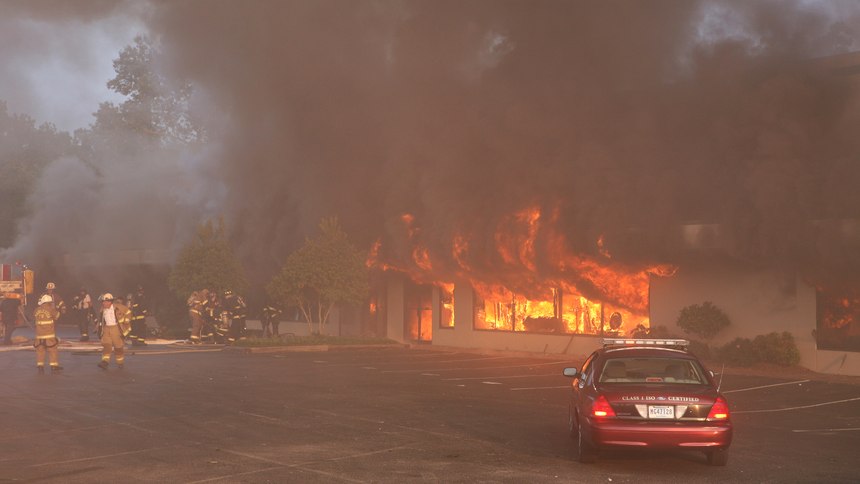 A fire sweeps through the Sofa Super Store furniture warehouse in Charleston, S.C. on Monday, June 18, 2007. Nine firefighters died in the blaze when a roof collapsed making it the nation's deadliest disaster for firefighters since the September 11th terrorist attacks.