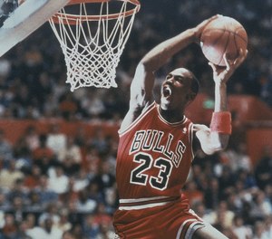Chicago Bulls’ guard Michael Jordan eyes the basket as he prepares to slam the ball through in a spectacular display of dunking talent. Jordan, for the second year, captured the slam dunk contest prior to the NBA All-Star game at Seattle’s King Dome in February 1987 in Washington.