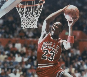 Chicago Bulls’ guard Michael Jordan eyes the basket as he prepares to slam the ball through in a spectacular display of dunking talent. Jordan, for the second year, captured the slam dunk contest prior to the NBA All-Star game at Seattle’s King Dome in February 1987 in Washington.