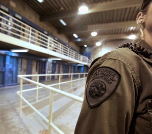 A correctional officer is seen in one of the housing units at Pelican Bay State Prison near Crescent City, Calif.