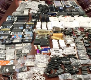 In this photo made available by the South Carolina Department of Corrections on Wednesday, April 6, 2016, shows cell phones that were seized in a single raid from the Lee Correctional Institution, S.C.
