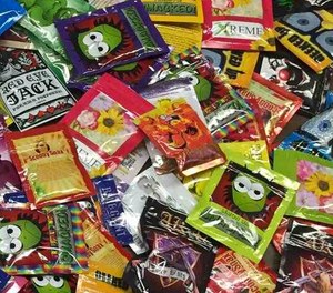 This Aug. 7, 2015, file photo provided by the New York Police Department shows packets of synthetic marijuana, known as K-2, on display in New York after they were seized in Brooklyn.