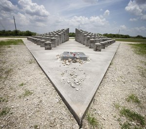 In this 2014 photo, rocks, coins and other items are left at the ValuJet Memorial in Everglades National Park, honoring the 110 people killed in the ValuJet Flight 592 crash on May 11, 1996. Tuesday marks the 25th anniversary of the tragedy.