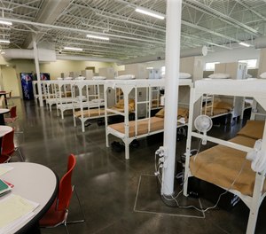 Beds are lined up inside a new facility at the Community Corrections Center in Lincoln, Neb., Thursday, Sept. 28, 2017.