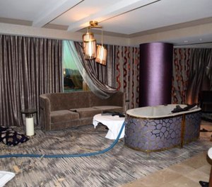 This Oct. 2017 photo released by the Las Vegas Metropolitan Police Department Force Investigation Team Report shows the view of foyer of room 32-135 toward a sitting area of the interior of Las Vegas shooter Stephen Paddock's 32nd floor room of the Mandalay Bay hotel in Las Vegas, an image released as part of a preliminary report by Clark County Sheriff Joe Lombardo on Friday, Jan. 19, 2018, in Las Vegas. Paddock began shooting into the crowd attending the Route 91 Music Festival from his hotel room into a crowd of 22,000 people attending the Route 91 Harvest Festival music below on Oct. 1, 2017.