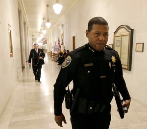 This Tuesday, Dec. 12, 2017 file photo San Francisco Police Chief William Scott walks to a meeting at City Hall in San Francisco.