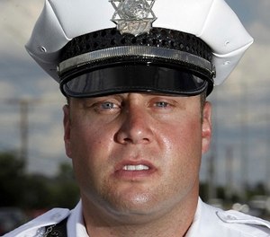 This file photo shows Columbus, Ohio, Police officer Zachary Rosen in Columbus, Ohio, recorded in a video April 8, 2017, subduing a restrained suspect in a way that appeared to show Rosen kicking the prone man in the head.