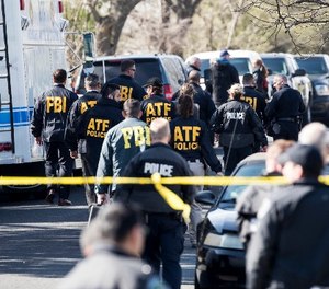 Authorities work on the scene of an explosion in Austin on Monday, March 12, 2018. (Ricardo B. Brazziell/Austin American-Statesman via AP)
