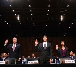 Thomas Brandon, deputy director of the Bureau of Alcohol, Tobacco, Firearms and Explosives, left, David Bowdich, associate deputy director of the Federal Bureau of Investigation, and Lina Alathari, a researcher with the U.S. Secret Service, are sworn in to testify at a Senate Judiciary Committee hearing on the Parkland, Fla., school shootings and school safety, Wednesday, March 14, 2018, on Capitol Hill in Washington. (AP Photo/Jacquelyn Martin)