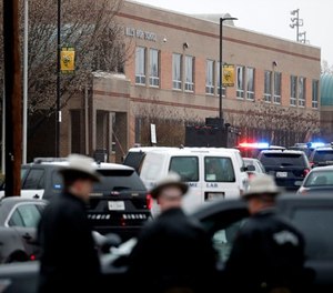 Deputies and federal agents converge on Great Mills High School, the scene of a shooting, Tuesday morning, March 20, 2018 in Great Mills, Md. The shooting left three people injured including the shooter. Authorities said the situation was