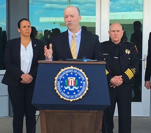 Sean Ragan, FBI special agent in charge, briefs reporters about a crash at the main gate of Travis Air Force Base, Calif., Friday, March 23, 2018. (AP Photo/Jonathan J. Cooper)