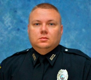 This photo provided by the Kentucky State Police shows Officer Phillip Meacham. The off-duty police officer was shot and killed Thursday, March 29, 2018, in Hopkinsville, Ky.