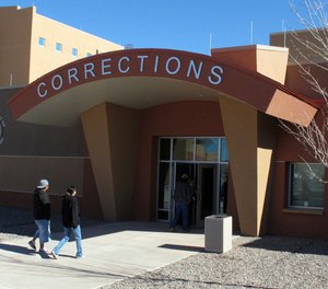 In this Feb. 15, 2013, file photo, visitors walk up to the new adult detention facility in Tuba City, Arizona. The facility is one of 96 either operated or funded by the Bureau of Indian Affairs.