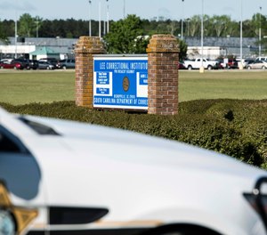 A police vehicle sits outside the Lee Correctional Institution on Monday, April 16, 2018, in Bishopville, S.C. Multiple inmates were killed and others seriously injured amid fighting between prisoners inside the maximum security prison in South Carolina.