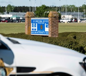 A police vehicle sits outside the Lee Correctional Institution on Monday, April 16, 2018, in Bishopville, S.C. Multiple inmates were killed and others seriously injured amid fighting between prisoners inside the maximum security prison in South Carolina.