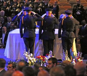 Colleagues salute their fallen comrade at the funeral for Dallas Police Officer Officer Rogelio Santander at Lake Pointe Church in Rockwall, Texas on Tuesday, May 1, 2018. Santander was shot and killed at a Home depot in Dallas last week.