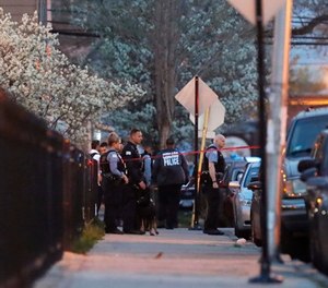 Chicago police work the scene near the area where a federal agent was shot and critically wounded in Chicago while working on an investigation with local authorities on Friday, May 4, 2018. (Jose M. Osorio/Chicago Tribune via AP)